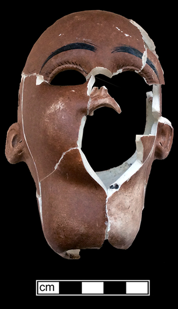 African-American doll head of painted bisque porcelain (also known as parian), with an impressed &ldquo;5&rdquo; on its neck. It also has holes for earrings. 11.5cm x 8cm x8cm - from 18MO609.